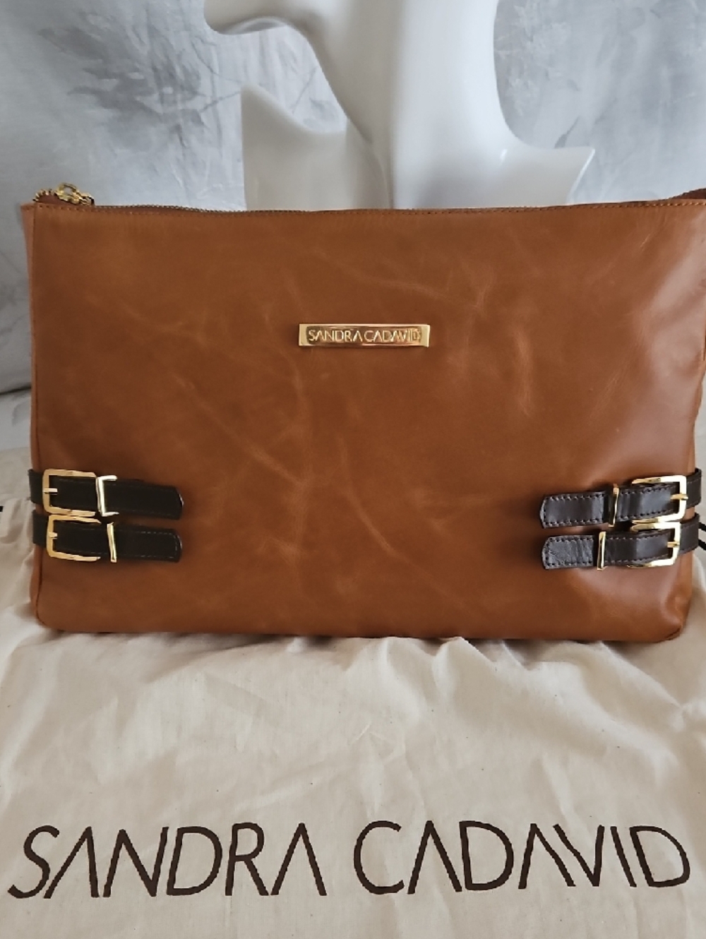 Sandra Cadavid Leather Clutch with Buckle Accents.